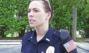 Female cops pull walk out on black suspect and suck his cock